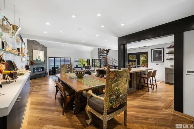 a kitchen with stainless steel appliances kitchen island granite countertop a refrigerator and stove