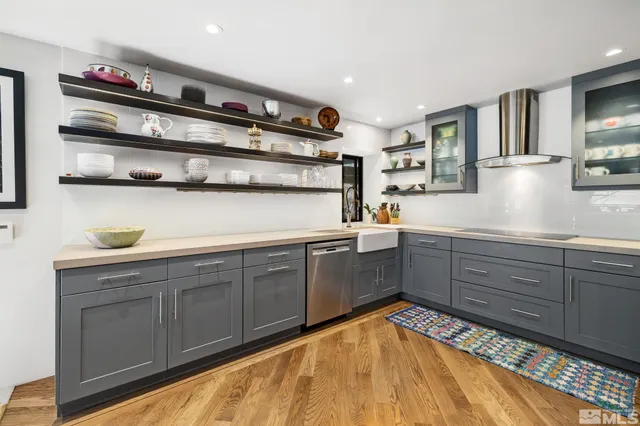 a large kitchen with a table and chairs in it