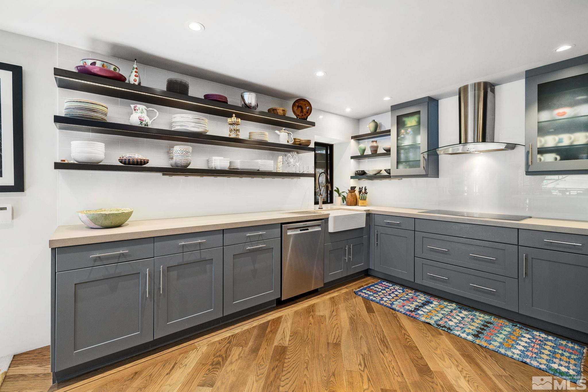 475 Lakeshore Boulevard, Unit 36 Incline Village, NV 89451 - Photo 18 of 40 a kitchen with stainless steel appliances granite countertop a sink and cabinets
