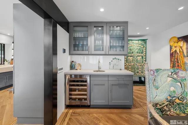 a bathroom with a toilet a sink and a mirror