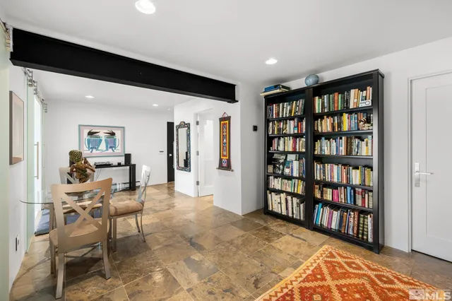 a bedroom with a bed and a flat tv screen