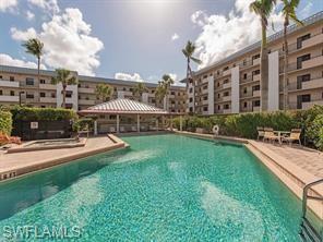 805 River Point Drive, Unit C307 Naples, FL 34102 - Photo 1 of 11 a view of a building with a yard
