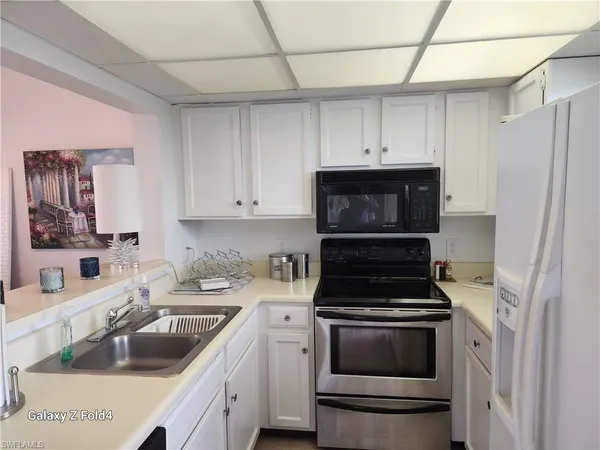 a kitchen with a stove and a sink