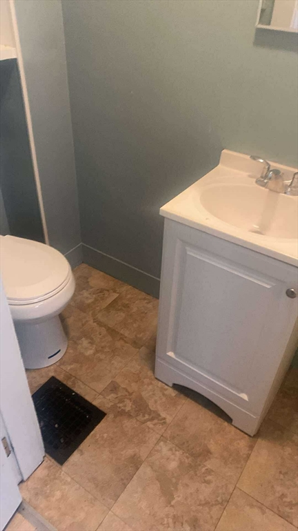 14-24 C Street, Unit 18 Northbridge, MA 01588 - Photo 5 of 9 a bathroom with a sink and a toilet