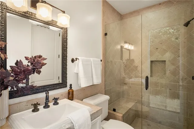 a view of a kitchen with a sink and wooden floor