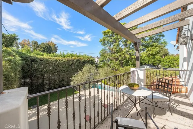 a bedroom with a large bed and a large window