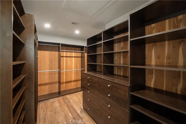 a bedroom with bed and a window