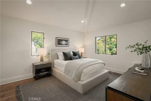 a bedroom with a bed and cabinets