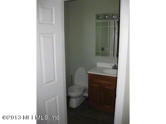4060 South Francis Road St. Augustine, FL 32092 - Photo 16 of 25 a bathroom with a toilet and a sink
