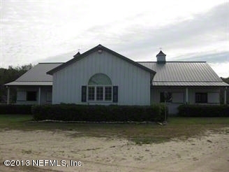 4060 South Francis Road St. Augustine, FL 32092 - Photo 2 of 25 a front view of a house with garden