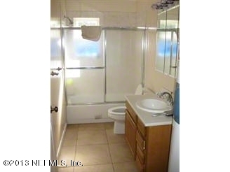4060 South Francis Road St. Augustine, FL 32092 - Photo 24 of 25 a bathroom with a sink toilet and shower