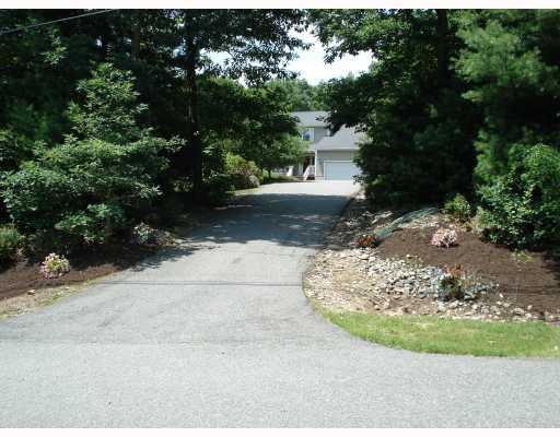 2 Ridgewood Trail Coventry, RI 02827 - Photo 3 of 12 Parking Lot/Garage. Home set back from the private road. This long driveway can accommodate six or more cars and the extra large 2 car garage also has room for storage..
