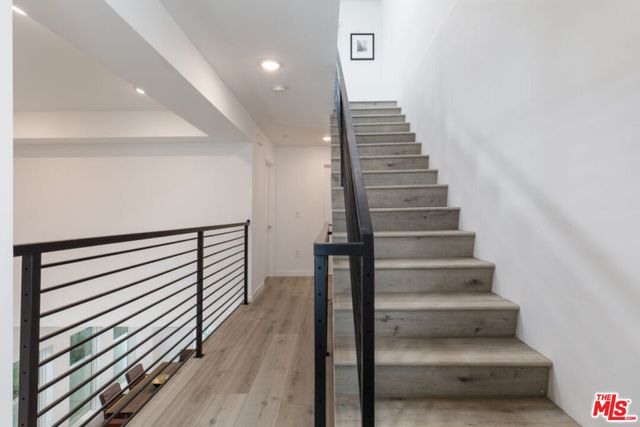 a bedroom with a bed and flat screen tv