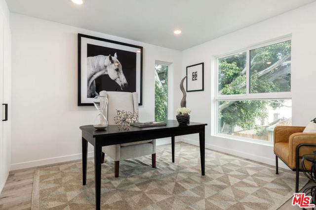 a bed room with a bed and a window