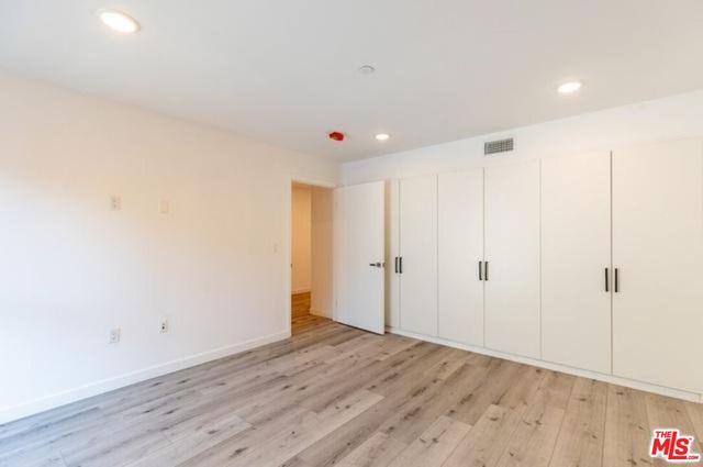 a view of a livingroom with wooden floor