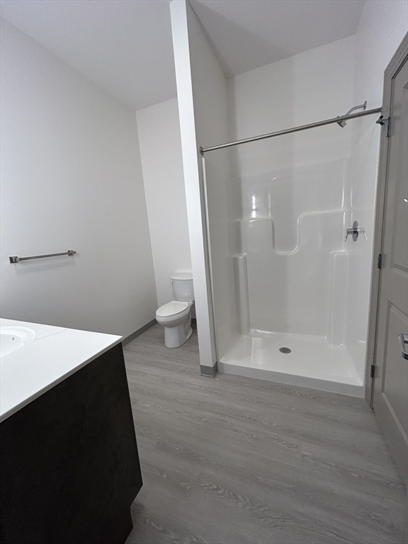 626 Main Street, Unit 209 Dennis, MA 02639 - Photo 12 of 18 a bathroom with a shower and a toilet