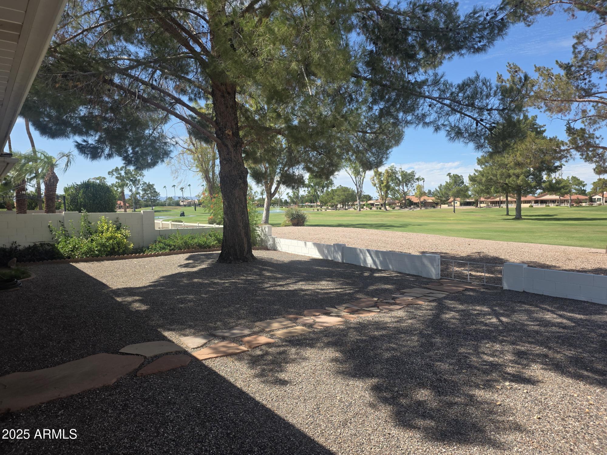 a view of a yard with an trees