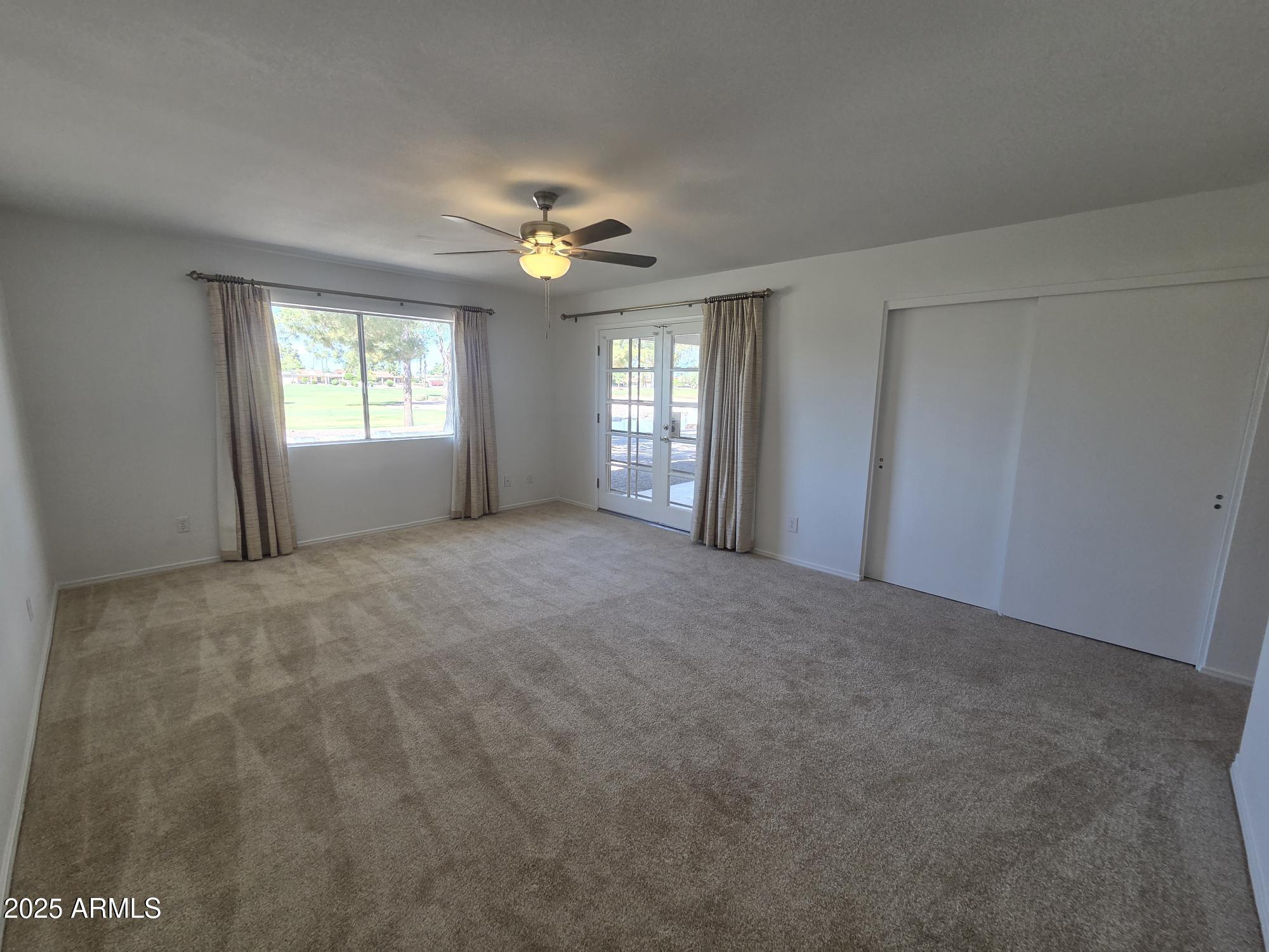 10242 East Spring Creek Road Sun Lakes, AZ 85248 - Photo 17 of 30 a view of an empty room with a window