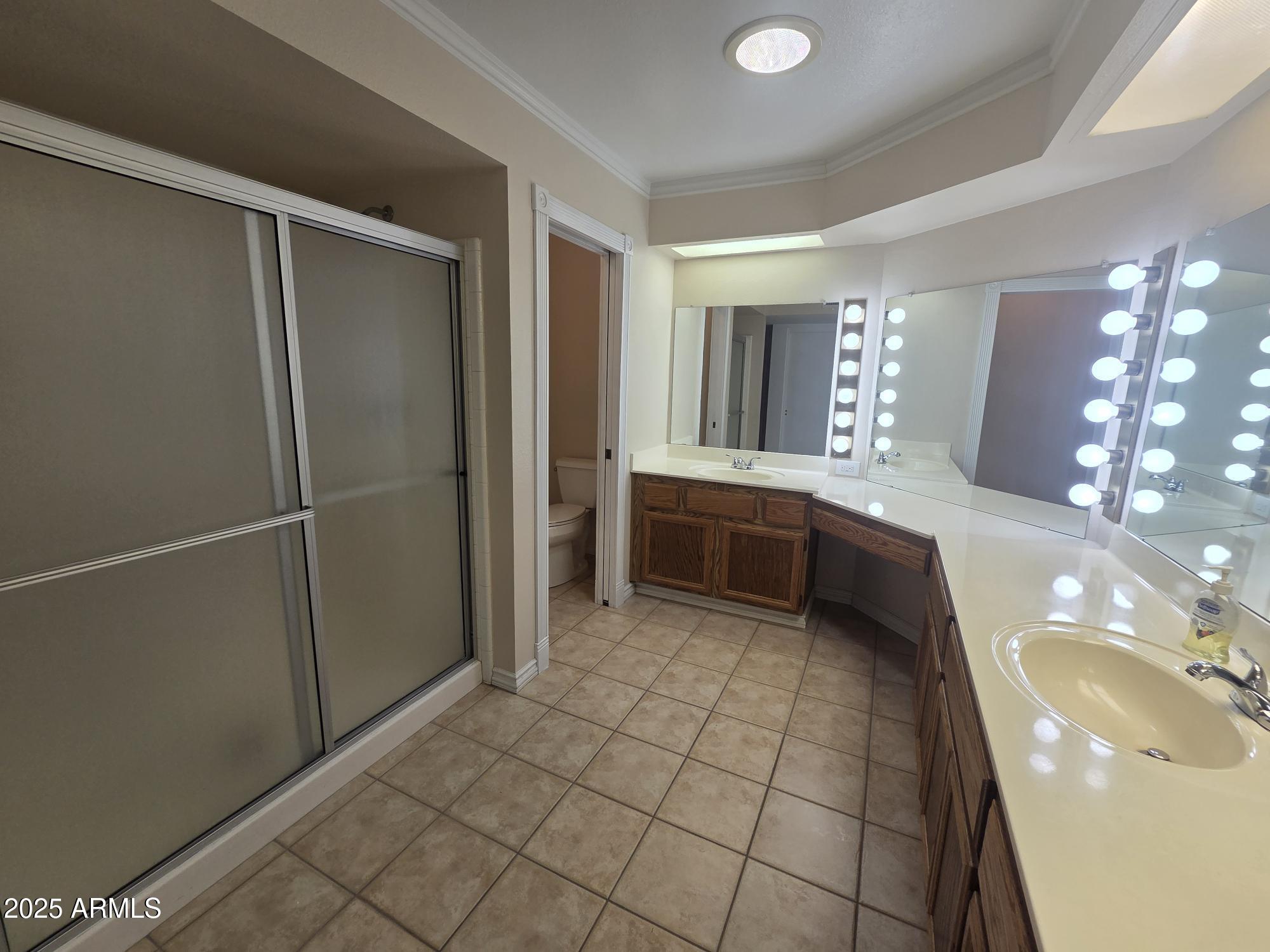10242 East Spring Creek Road Sun Lakes, AZ 85248 - Photo 20 of 30 a bathroom with a sink and mirror