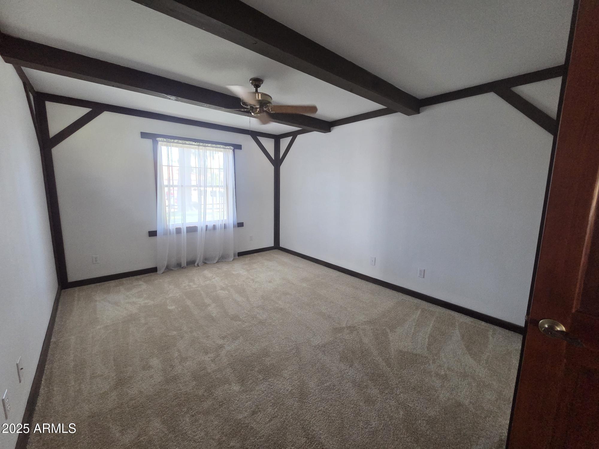 10242 East Spring Creek Road Sun Lakes, AZ 85248 - Photo 23 of 30 an empty room with windows