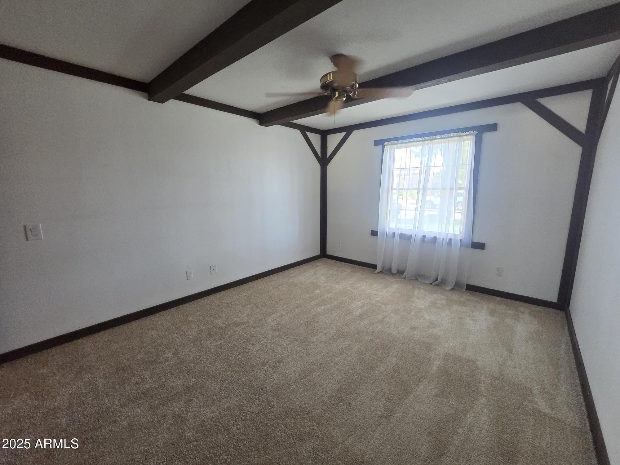 10242 East Spring Creek Road Sun Lakes, AZ 85248 - Photo 24 of 30 an empty room with a empty space and windows