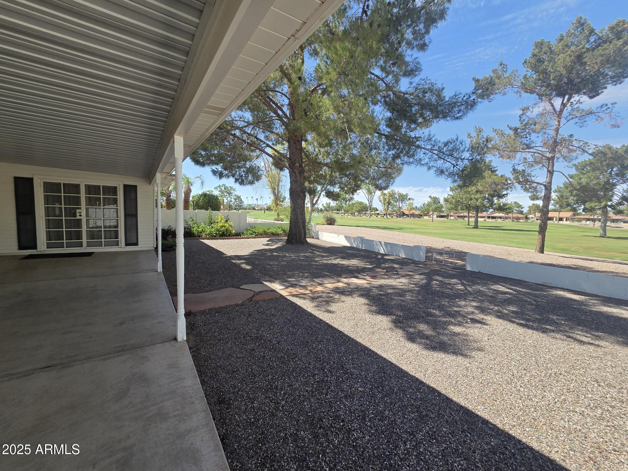 10242 East Spring Creek Road Sun Lakes, AZ 85248 - Photo 28 of 30 a view of a yard with an outdoor space