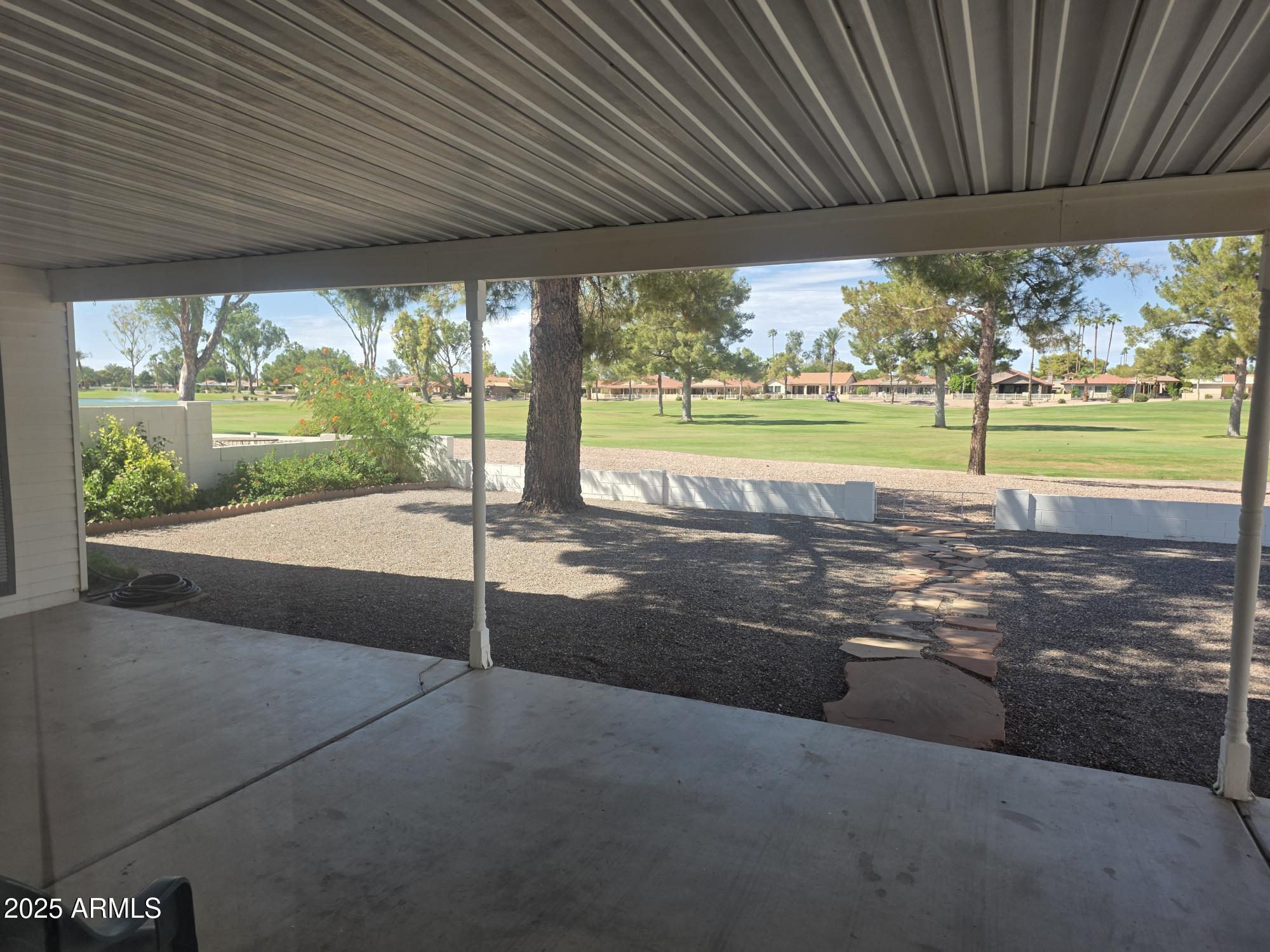 10242 East Spring Creek Road Sun Lakes, AZ 85248 - Photo 6 of 30 a view of a swimming pool with yard from a ceiling fan