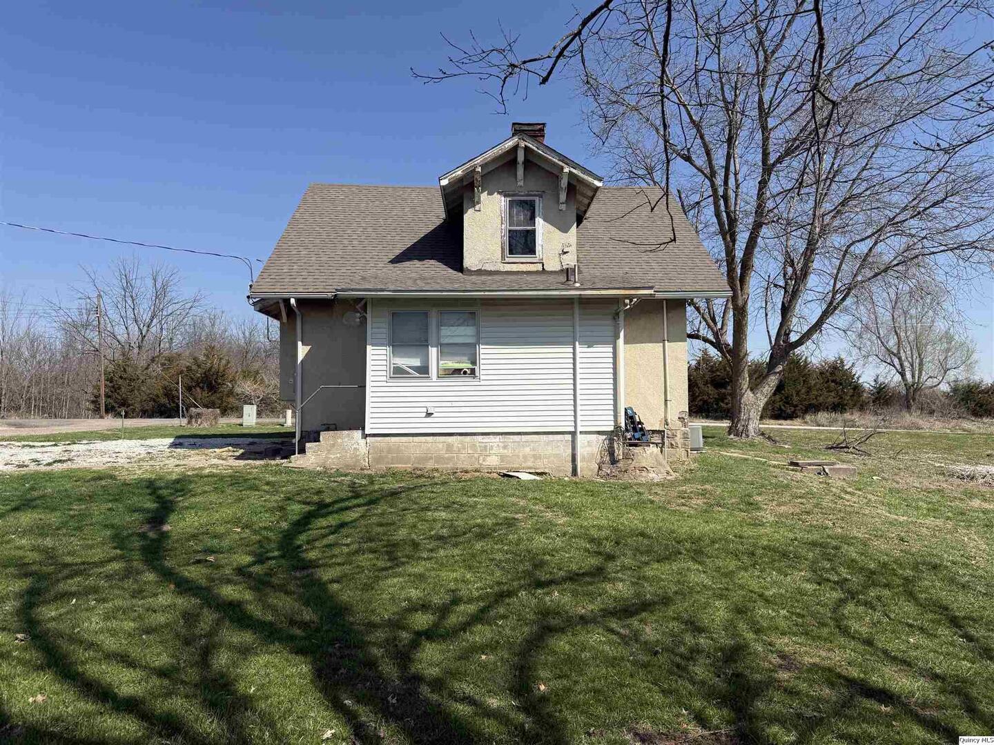 622 East Center Street Loraine, IL 62349 - Photo 5 of 21 a front view of a house with a yard