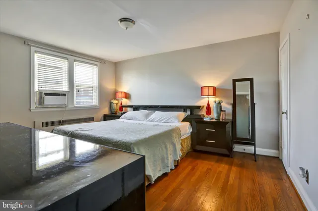 a bed room with a bed and a tv