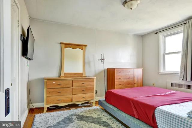 a bedroom with a bed and a closet