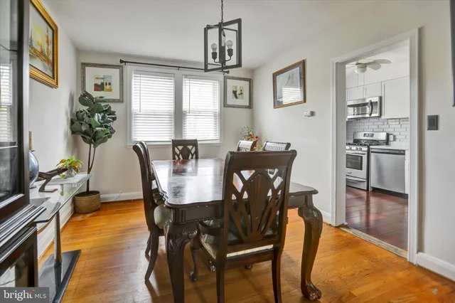 a view of a dining room with furniture and a window