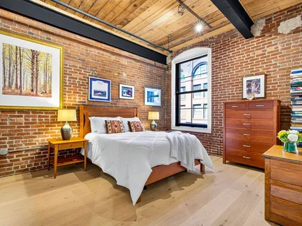 a bed sitting in front of a house