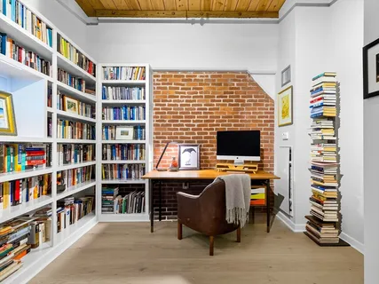 a view of a workspace with furniture