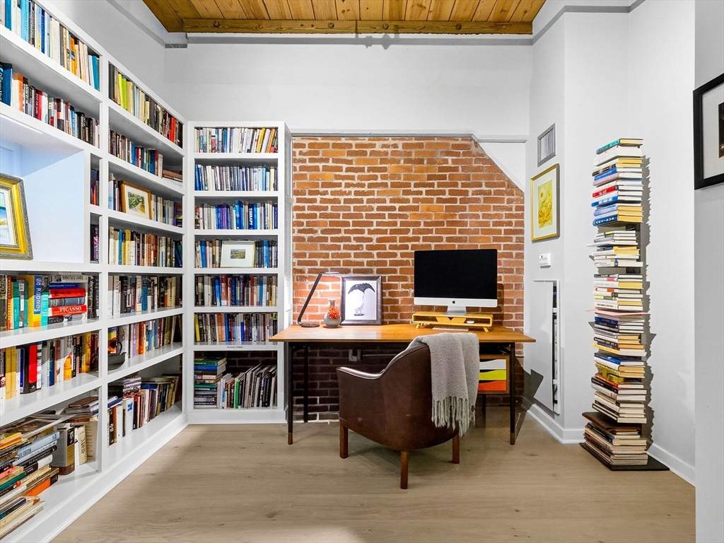 1245 Adams Street, Unit B406 Boston, MA 02124 - Photo 17 of 31 a view of a workspace with furniture