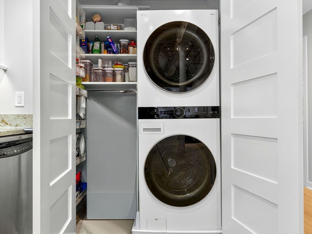 1245 Adams Street, Unit B406 Boston, MA 02124 - Photo 18 of 31 a close up view of a washer and dryer