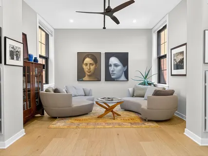 a living room with furniture and window