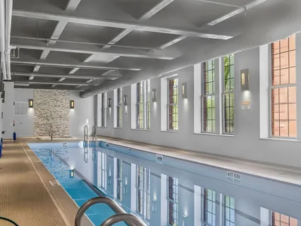 a view of a patio with couches table and chairs and potted plants