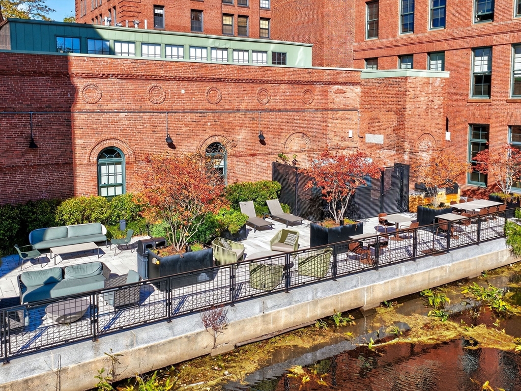 1245 Adams Street, Unit B406 Boston, MA 02124 - Photo 24 of 31 a view of a chairs with potted plants