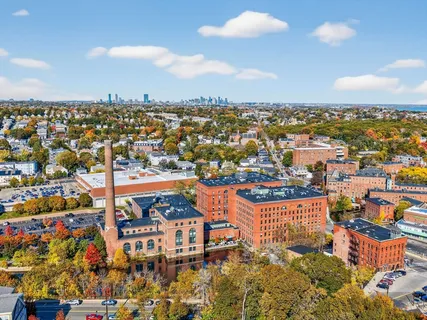 an aerial view of residential building and parking space