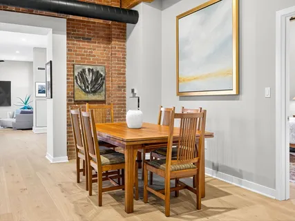 a dining room with furniture and window