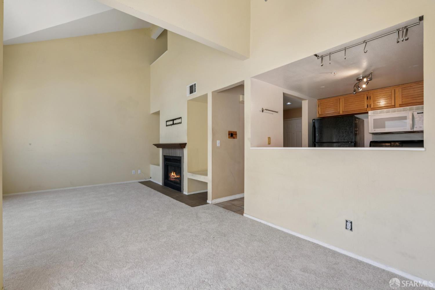 4628 Melody Drive, Unit D Concord, CA 94521 - Photo 11 of 30 a view of a kitchen with furniture and a ceiling fan
