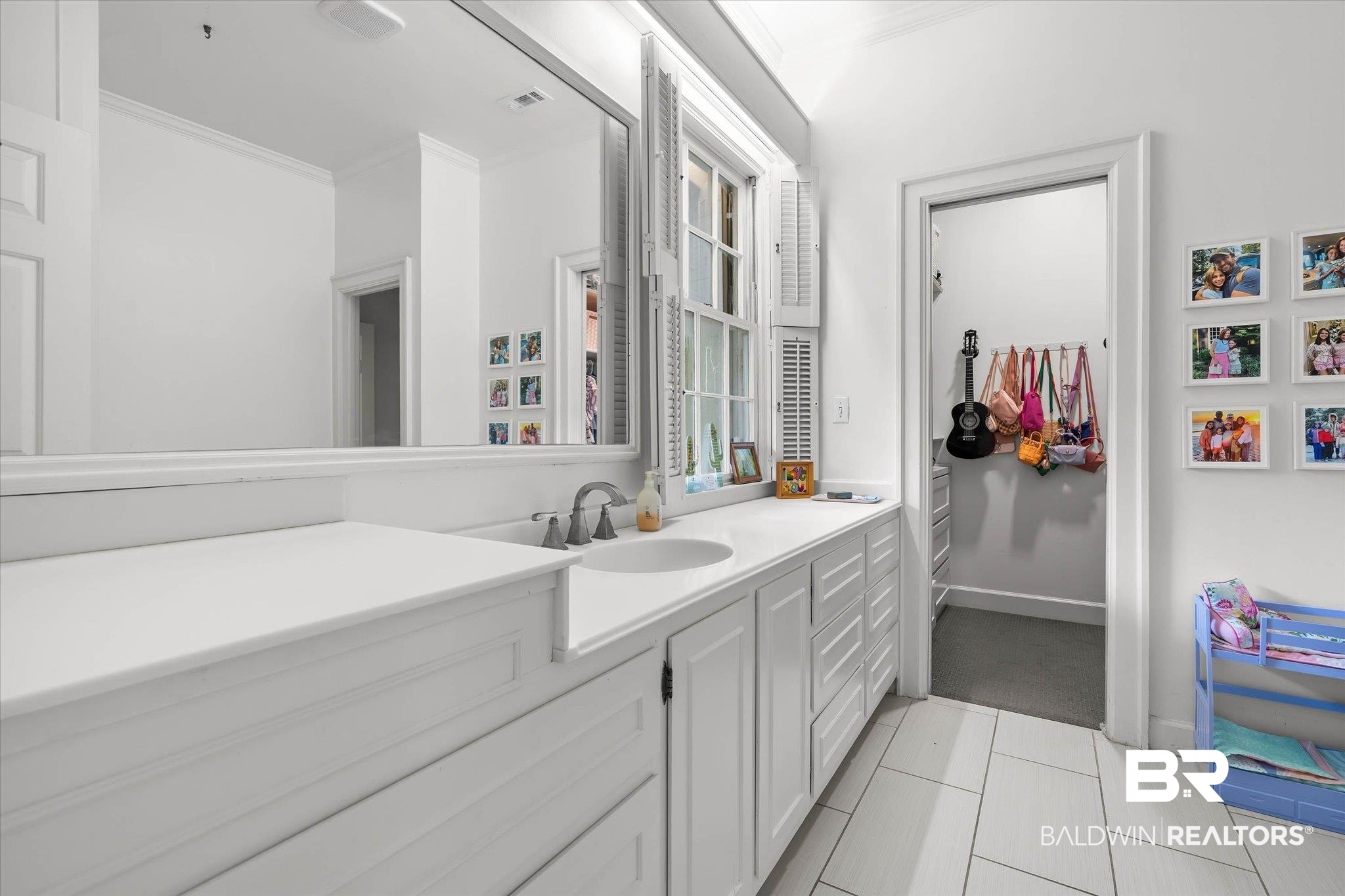 3908 Yester Place Mobile, AL 36608 - Photo 29 of 45 White vanity with integrated sink, brushed nickel faucet, and extensive counter space