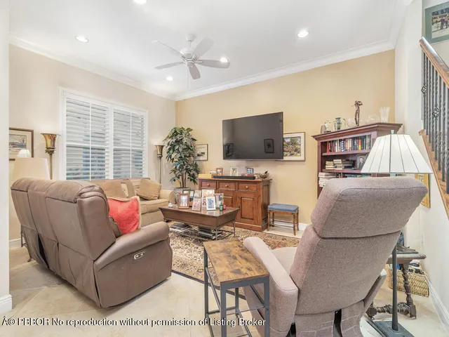 a kitchen with stainless steel appliances granite countertop a sink dishwasher a stove a refrigerator with a dining table and chairs