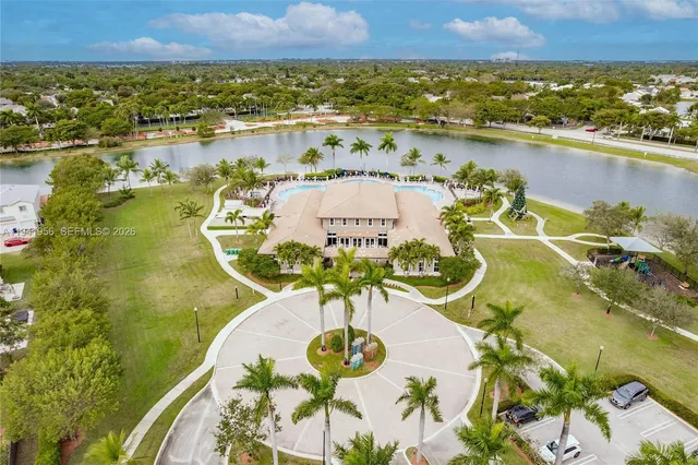 an aerial view of a house with a lake view