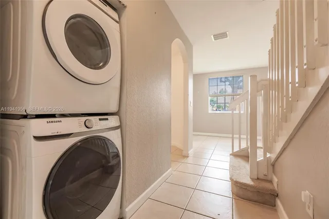 a view of a hallway with washer and dryer