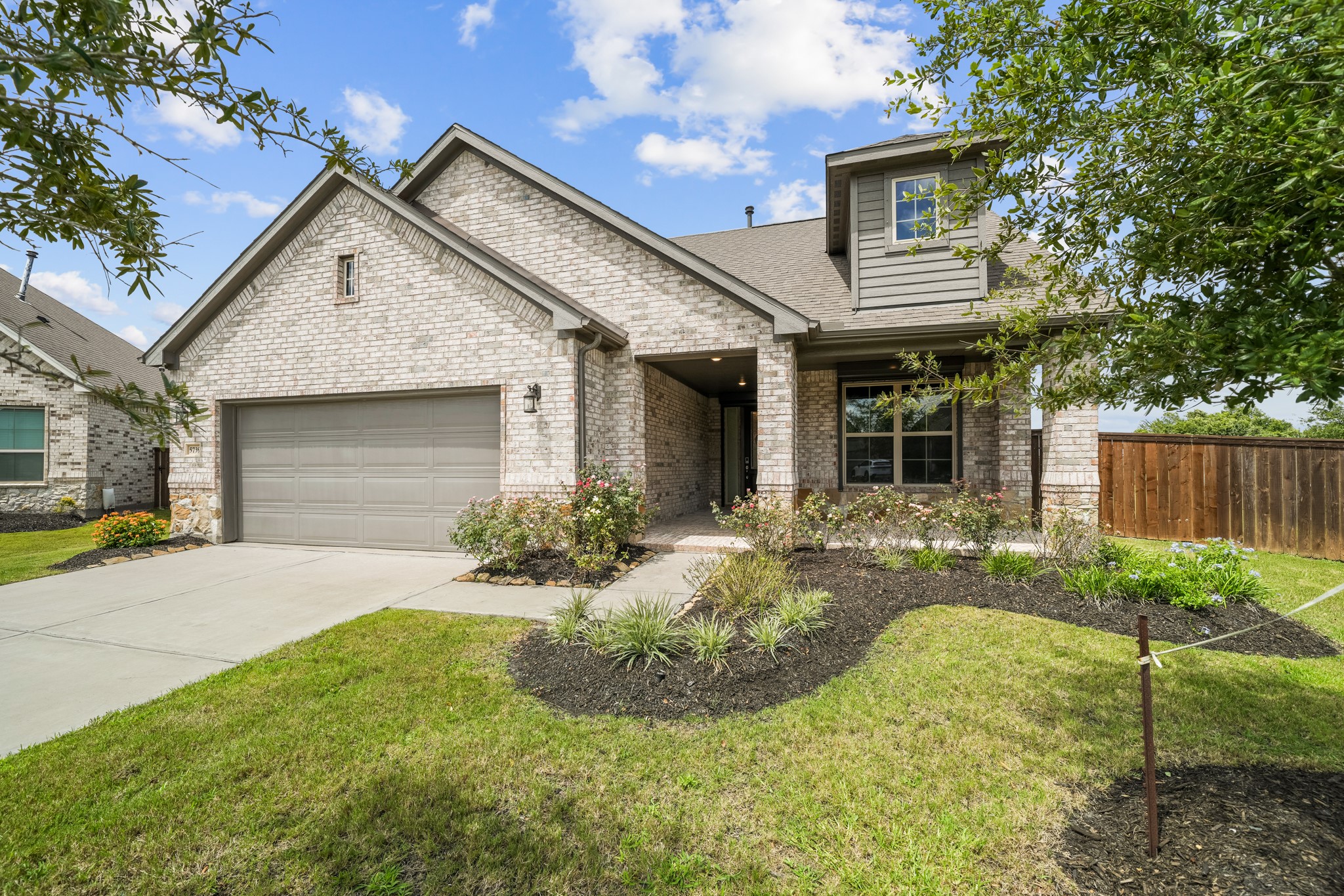 5739 Bobwhite Trail Manvel, TX 77578 - Photo 1 of 29 Beautiful curb appeal begins with timeless brick architecture, manicured landscaping, and a welcoming covered entry. Every detail creates an inviting first impression.