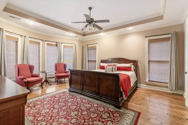 a bed room with a bed and a television