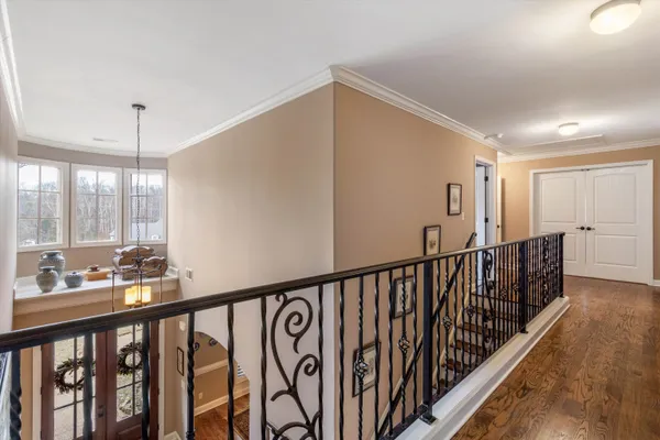 a bedroom with a bed and a television