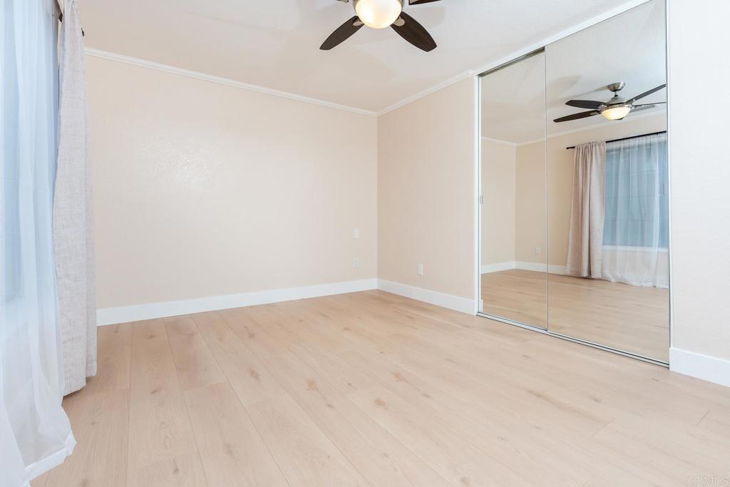 3913 Summer Way Escondido, CA 92025 - Photo 15 of 40 an empty room with ceiling fan and window