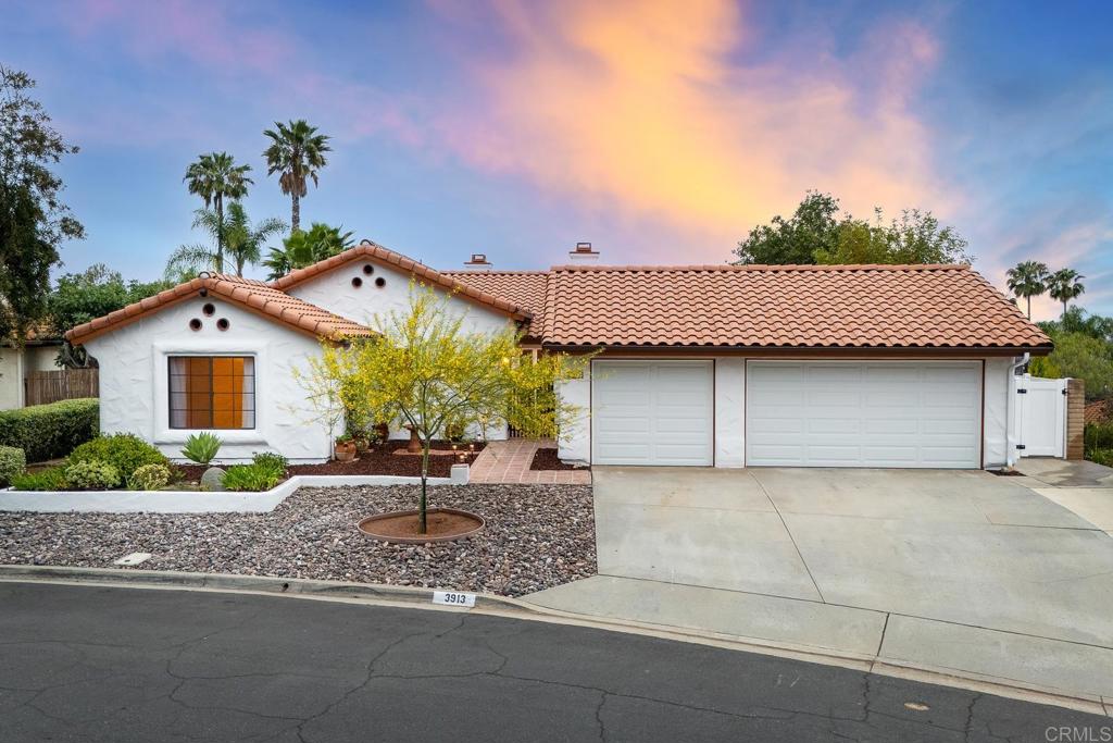 3913 Summer Way Escondido, CA 92025 - Photo 21 of 40 a front view of a house with a yard and garage